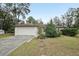 Single-story house with attached garage and driveway at 15831 Se 89Th Ter, Summerfield, FL 34491