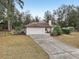 Single-story house with attached garage and driveway at 15831 Se 89Th Ter, Summerfield, FL 34491