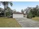 Single-story house with attached garage and driveway at 15831 Se 89Th Ter, Summerfield, FL 34491