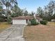 Single-story house with attached garage and driveway at 15831 Se 89Th Ter, Summerfield, FL 34491