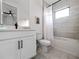 Bathroom with tub shower combo and white vanity at 16254 Ravenna Ct, Bella Collina, FL 34756