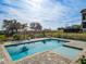 Inviting rectangular pool with spa, surrounded by pavers at 16254 Ravenna Ct, Bella Collina, FL 34756