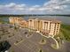 Condo building with lakefront views and ample parking at 16300 County Road 455 # 414, Bella Collina, FL 34756