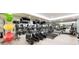 Community gym with modern exercise equipment, mirrored walls, and plenty of open space at 16300 County Road 455 # 414, Bella Collina, FL 34756