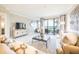 Bright living room boasting water views, contemporary decor, and a cozy seating area at 16300 County Road 455 # 414, Bella Collina, FL 34756