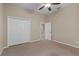 Spacious bedroom with double doors leading to closet at 16904 Se 110Th Court Rd, Summerfield, FL 34491