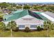 Stonecrest community clubhouse with green roof and pool view at 16904 Se 110Th Court Rd, Summerfield, FL 34491