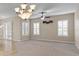 Dining room with chandelier, ceiling fan and window at 16904 Se 110Th Court Rd, Summerfield, FL 34491