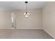 Bright dining room features a chandelier and carpet at 16904 Se 110Th Court Rd, Summerfield, FL 34491