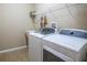 Laundry room with washer, dryer, and utility sink at 16904 Se 110Th Court Rd, Summerfield, FL 34491