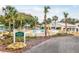 Inviting community pool with lounge chairs, umbrellas, and palm trees at 16904 Se 110Th Court Rd, Summerfield, FL 34491