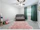 Bedroom with crib and plush rug at 1805 Jefferson Dr, Mount Dora, FL 32757