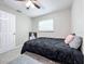 Relaxing bedroom with black bedding and window at 1805 Jefferson Dr, Mount Dora, FL 32757