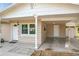 Front entryway with carport and white door at 1805 Jefferson Dr, Mount Dora, FL 32757