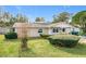 Newly renovated tan house with well-maintained lawn at 1805 Jefferson Dr, Mount Dora, FL 32757