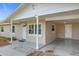 Front entryway with columns, white door and updated light fixture at 1805 Jefferson Dr, Mount Dora, FL 32757