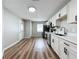 Modern white kitchen with stainless steel appliances at 1805 Jefferson Dr, Mount Dora, FL 32757