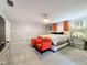 Spacious main bedroom with orange accent chairs at 1805 Jefferson Dr, Mount Dora, FL 32757