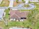 Aerial view shows house, yard, and neighborhood setting at 21524 Queen Anne Ct, Leesburg, FL 34748