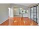 Bright dining area with hardwood floors and view of kitchen at 21524 Queen Anne Ct, Leesburg, FL 34748