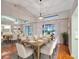 Dining room with hardwood floors, large table and chairs at 21524 Queen Anne Ct, Leesburg, FL 34748