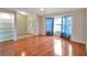 Living room with hardwood floors, entryway view, and bay window at 21524 Queen Anne Ct, Leesburg, FL 34748