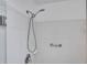 Shower stall with tiled walls and a handheld shower head at 21524 Queen Anne Ct, Leesburg, FL 34748