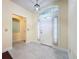 Bright foyer with elegant tile flooring, decorative lighting, and inviting entrance to the home at 2209 Stonebridge Way, Clermont, FL 34711