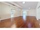 Spacious living room featuring wood floors, recessed lighting, and archways leading to other rooms at 2209 Stonebridge Way, Clermont, FL 34711