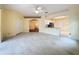 Spacious living area features tile flooring and an arched entry way at 2209 Stonebridge Way, Clermont, FL 34711