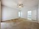 Spacious primary bedroom with neutral carpet and an ensuite bathroom at 2209 Stonebridge Way, Clermont, FL 34711