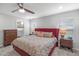 Main bedroom with king-size bed and access to ensuite bathroom at 2311 Sunset Way, Davenport, FL 33837