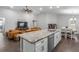 Modern kitchen with island, granite countertops and stainless steel appliances at 2311 Sunset Way, Davenport, FL 33837