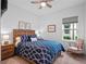 Spacious bedroom with a ceiling fan and large window at 2597 Mariotta Rdg, Clermont, FL 34715