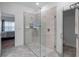 Spacious walk-in shower with glass enclosure and modern tile at 2597 Mariotta Rdg, Clermont, FL 34715