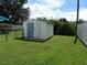 Backyard with storage shed and chain link fence at 2620 Janet St, Kissimmee, FL 34741