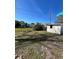 Backyard with shed and grassy area, showing a clear view at 2620 Janet St, Kissimmee, FL 34741