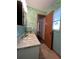 Bathroom with vanity and view into hallway at 2620 Janet St, Kissimmee, FL 34741