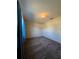 Bright bedroom with carpeted floors and blue curtains at 2620 Janet St, Kissimmee, FL 34741