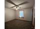 Bedroom with carpet, window, and ceiling fan at 2620 Janet St, Kissimmee, FL 34741