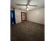 Bright bedroom with carpeted floor and ceiling fan at 2620 Janet St, Kissimmee, FL 34741