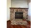 Brick fireplace with a hearth and a wood-burning stove at 2620 Janet St, Kissimmee, FL 34741