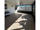 Relaxing screened porch with tiled floor and a ceiling fan at 2620 Janet St, Kissimmee, FL 34741