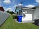 Side yard with shed, fenced area, and AC unit at 2620 Janet St, Kissimmee, FL 34741