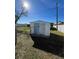 White storage shed in the backyard, offering extra storage at 2620 Janet St, Kissimmee, FL 34741