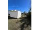 White storage shed in the backyard providing ample storage space at 2620 Janet St, Kissimmee, FL 34741