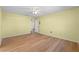 Bright bedroom with wood flooring and ceiling fan at 26548 Deuce Ct, Leesburg, FL 34748