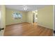 Bedroom with wood-look floors and en-suite bathroom at 26548 Deuce Ct, Leesburg, FL 34748