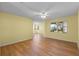 Spacious living room featuring light walls and wood-look floors at 26548 Deuce Ct, Leesburg, FL 34748