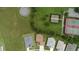 Aerial view of homes and tennis courts in community at 26715 Manassas Dr, Leesburg, FL 34748